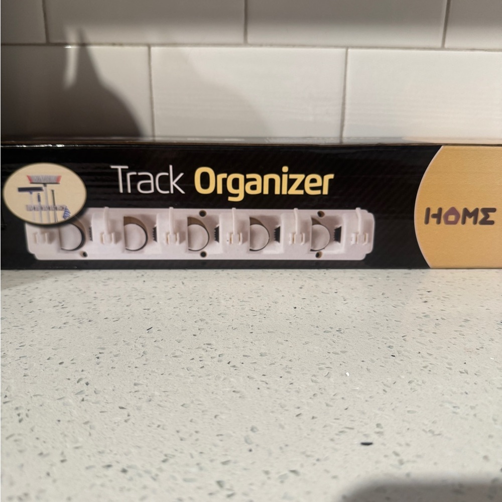 Track Organizer - broom storage